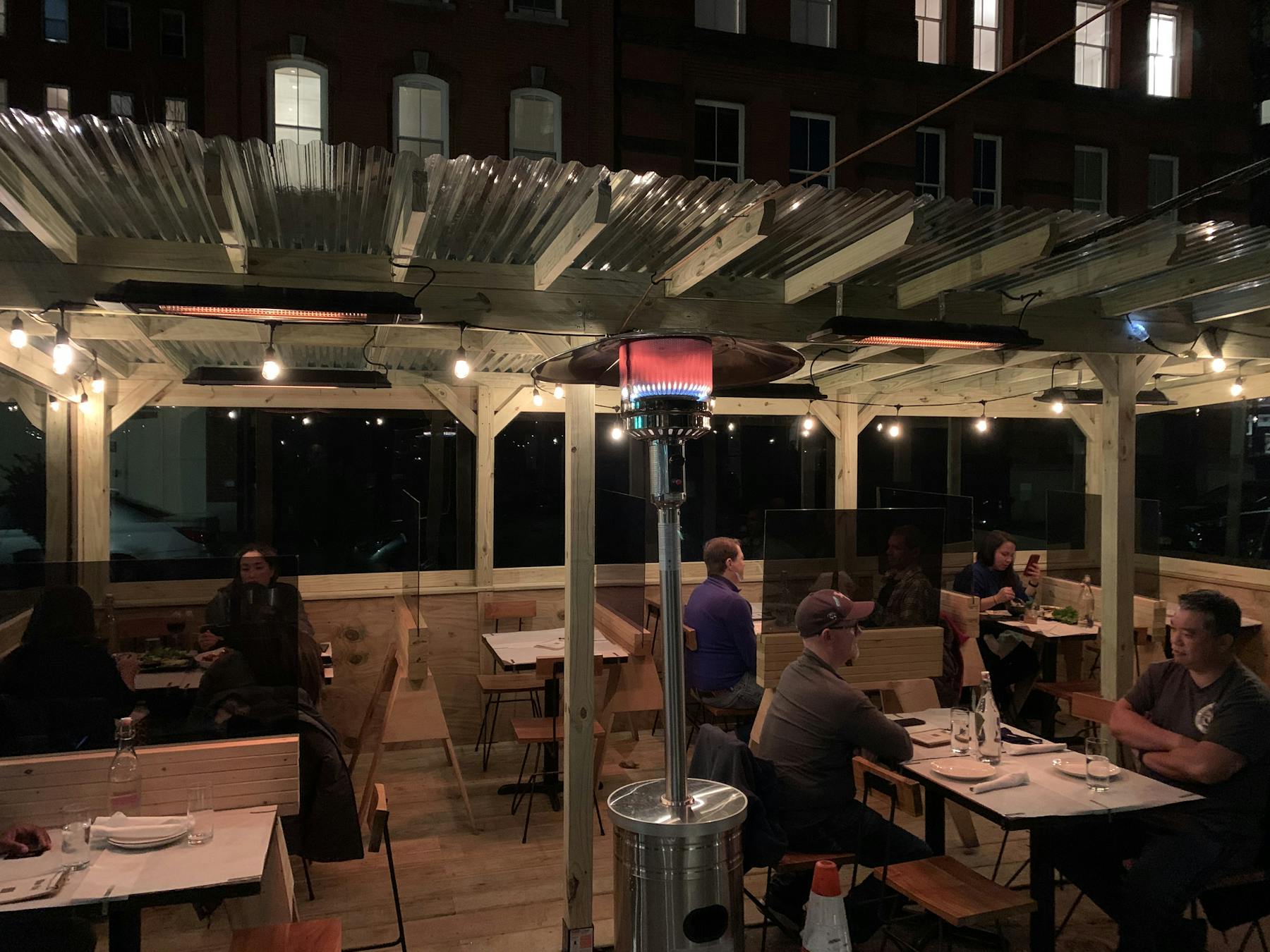 a group of people sitting at a table in a restaurant