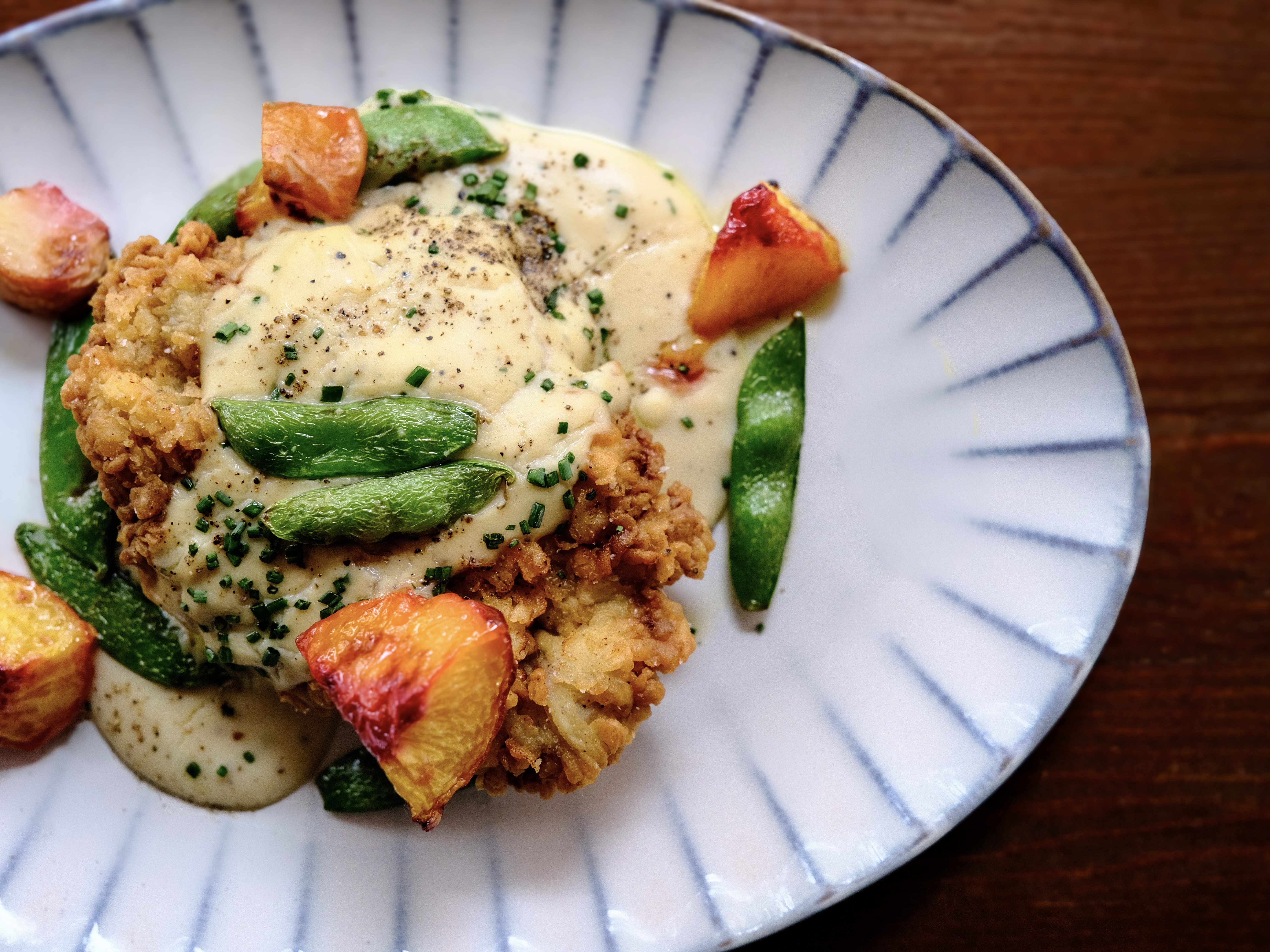 a plate of food on a wood table