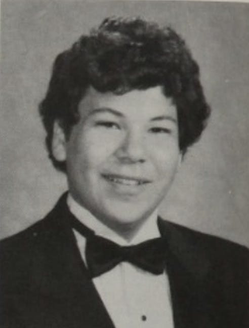 a vintage photo of a man wearing a suit and tie