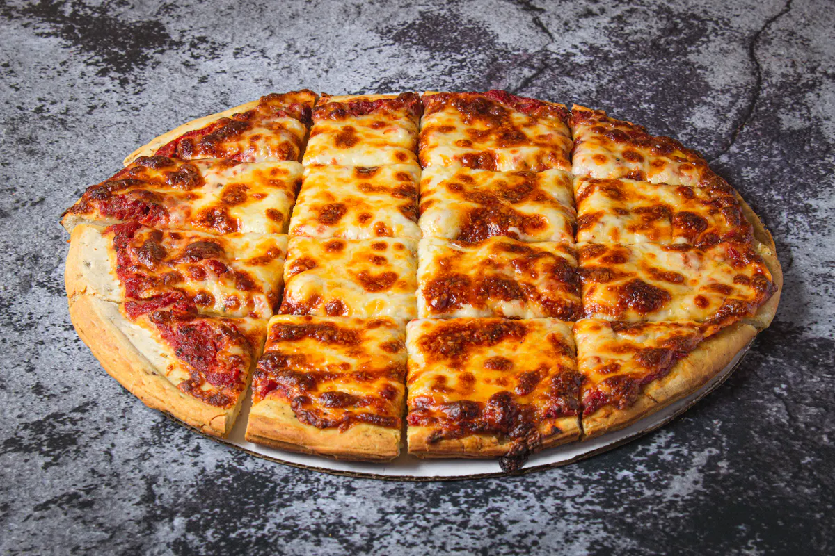 a pizza sitting on top of a pan on a table