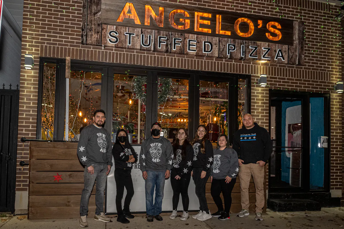 a group of people standing in front of a building