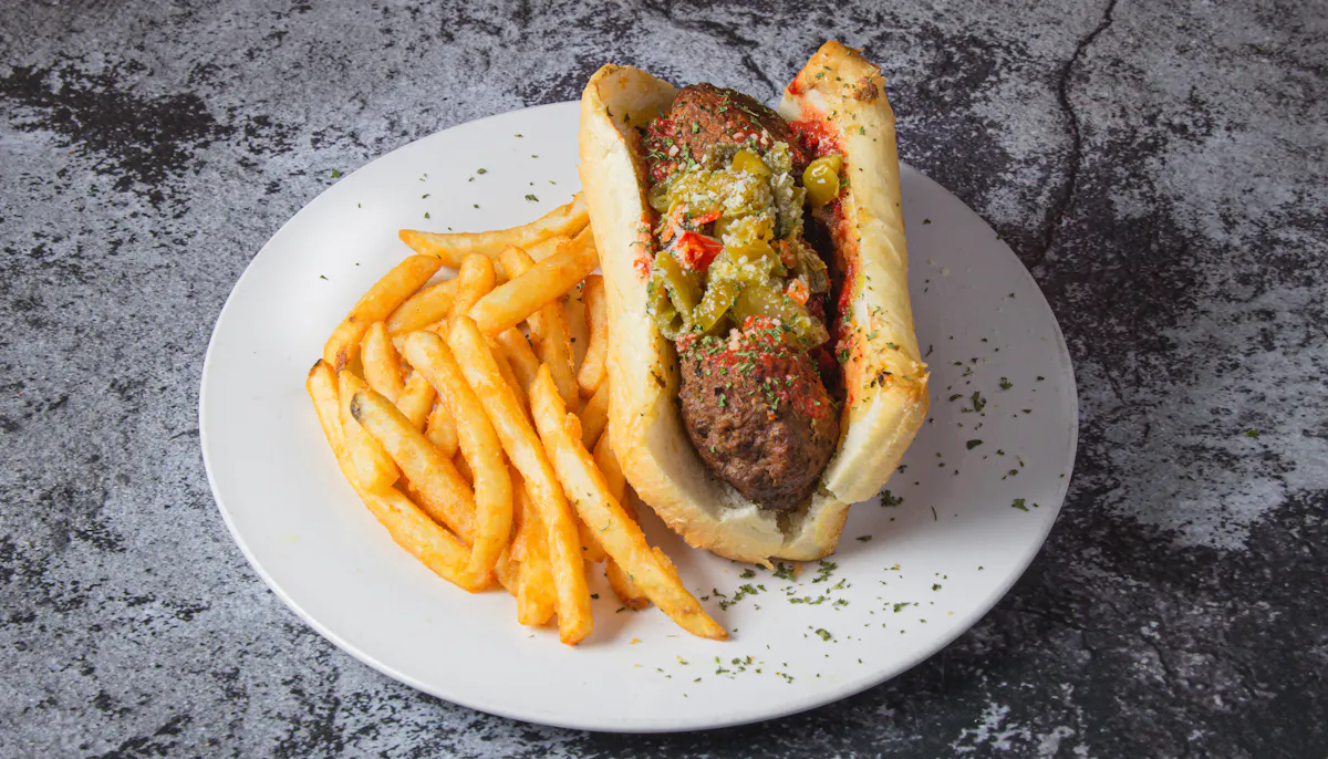 a plate with a hot dog