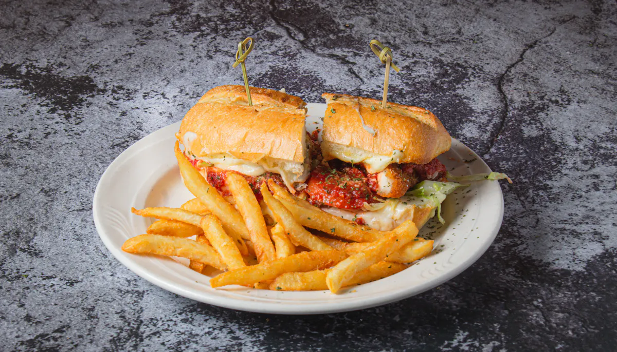 a sandwich sitting on top of a plate of food