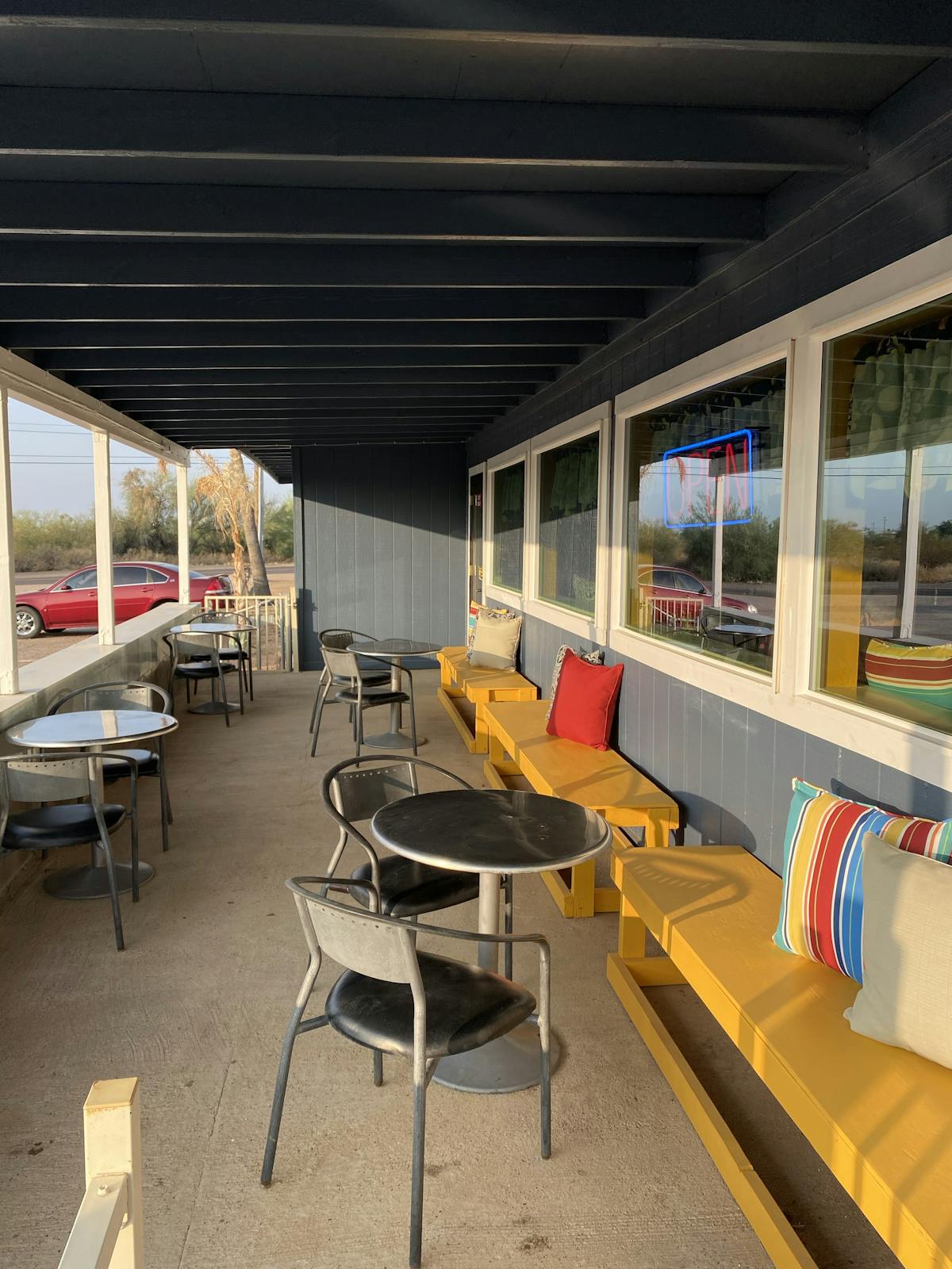 a room filled with furniture and a table in front of a building