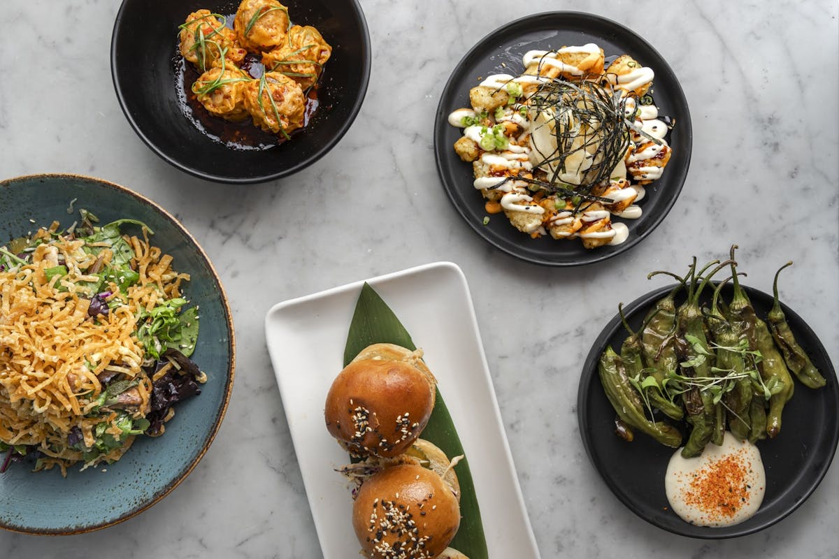 image of table with different menu items on top such as burgers