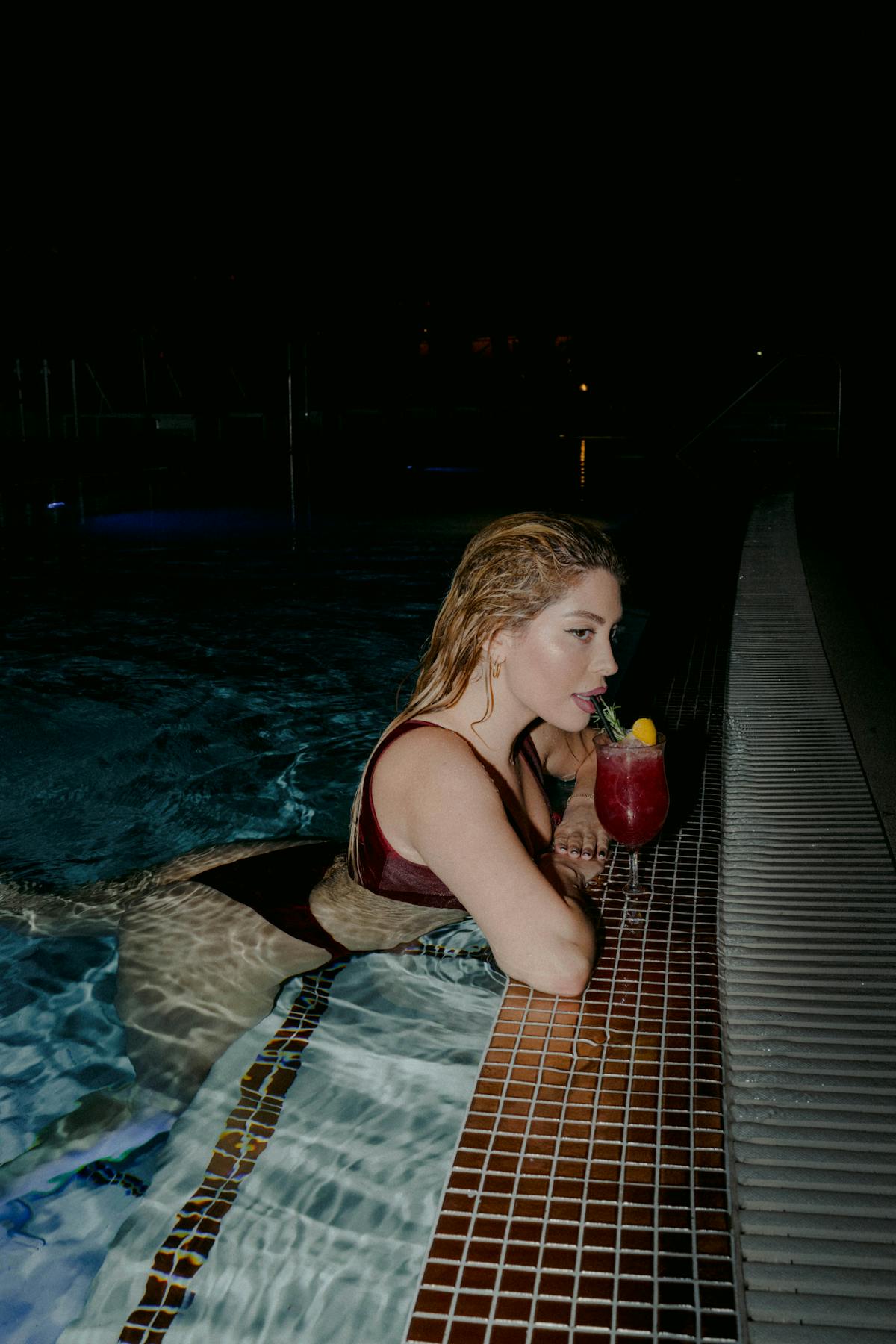 a person holding a glass of water