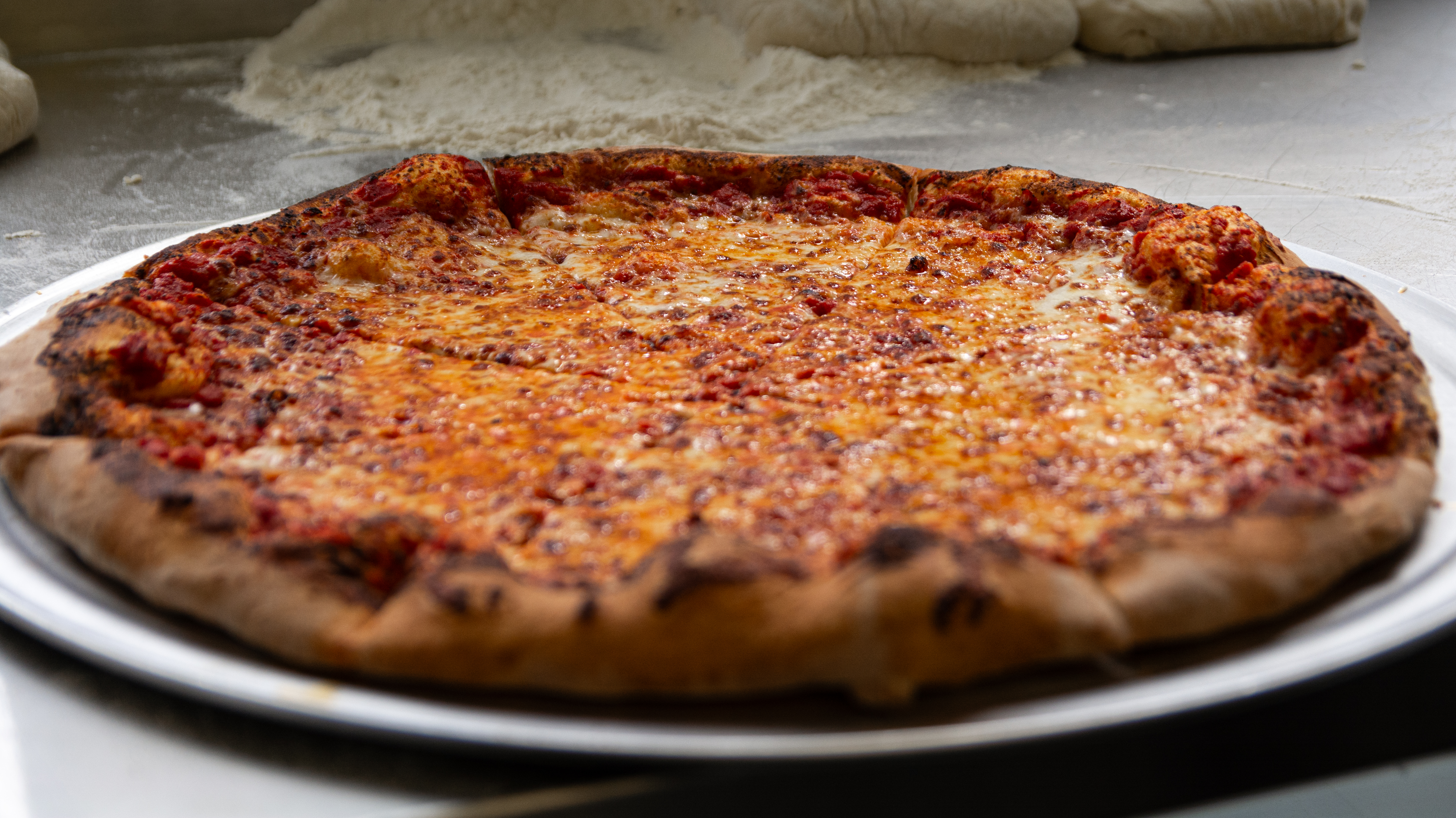 a close up of a slice of pizza sitting on top of a table