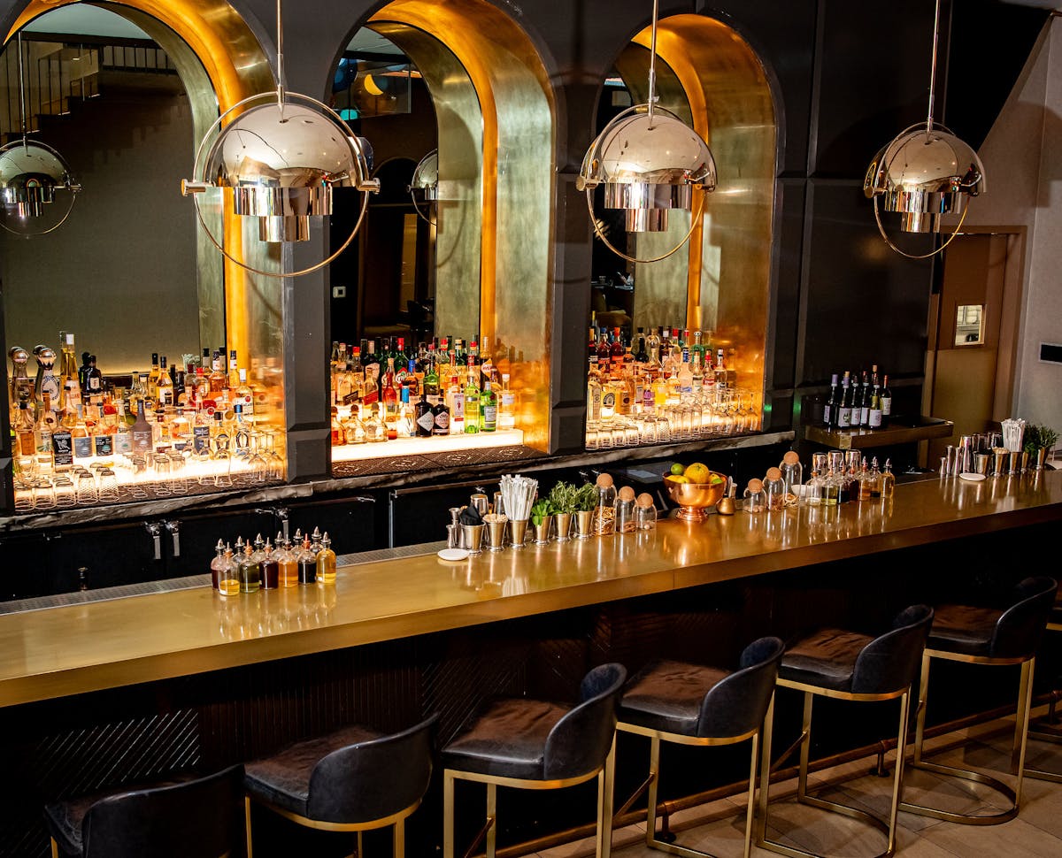 a row of wine glasses on a table