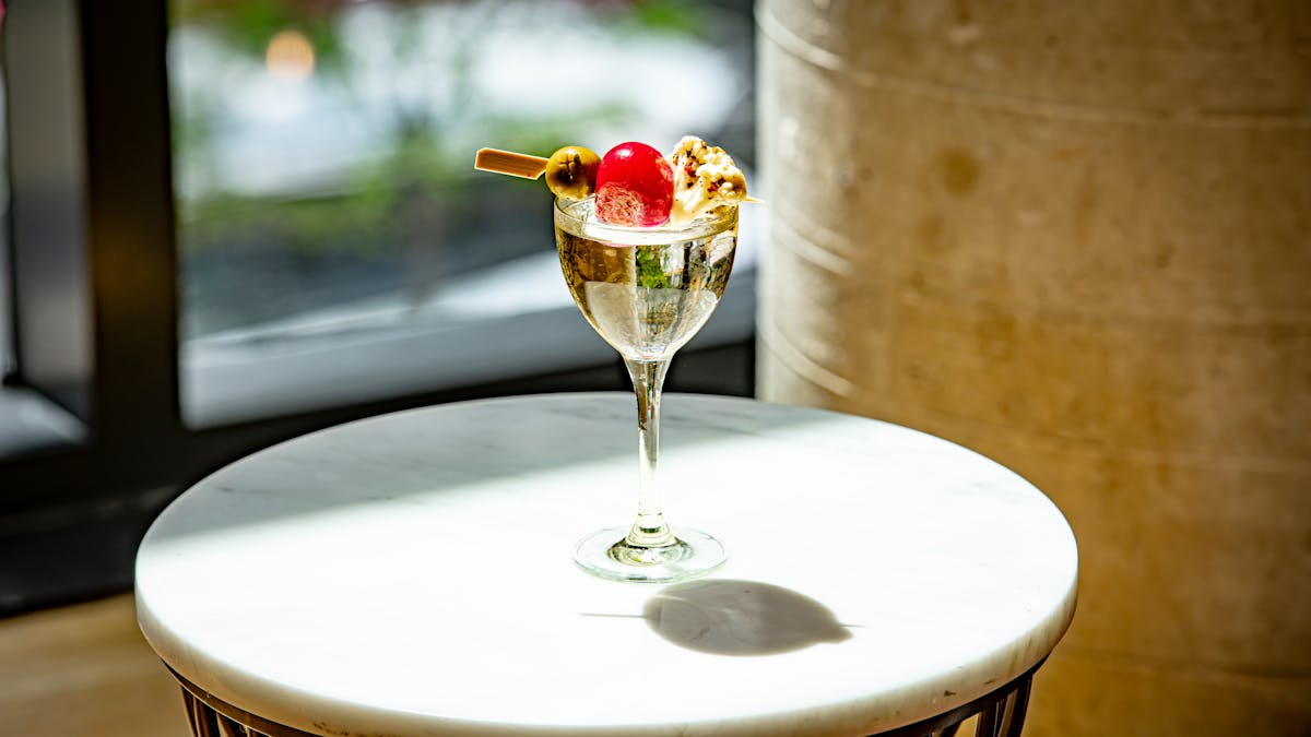 Martini cocktail on white table