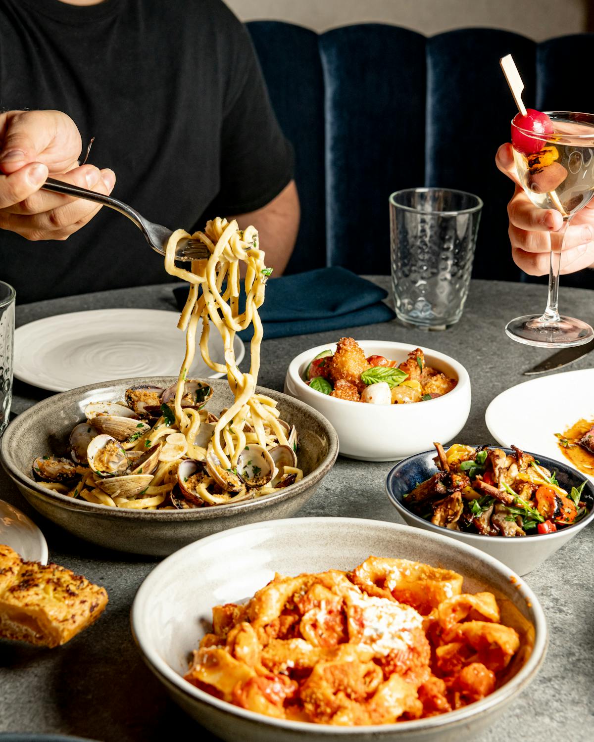 Table of pasta and drinks