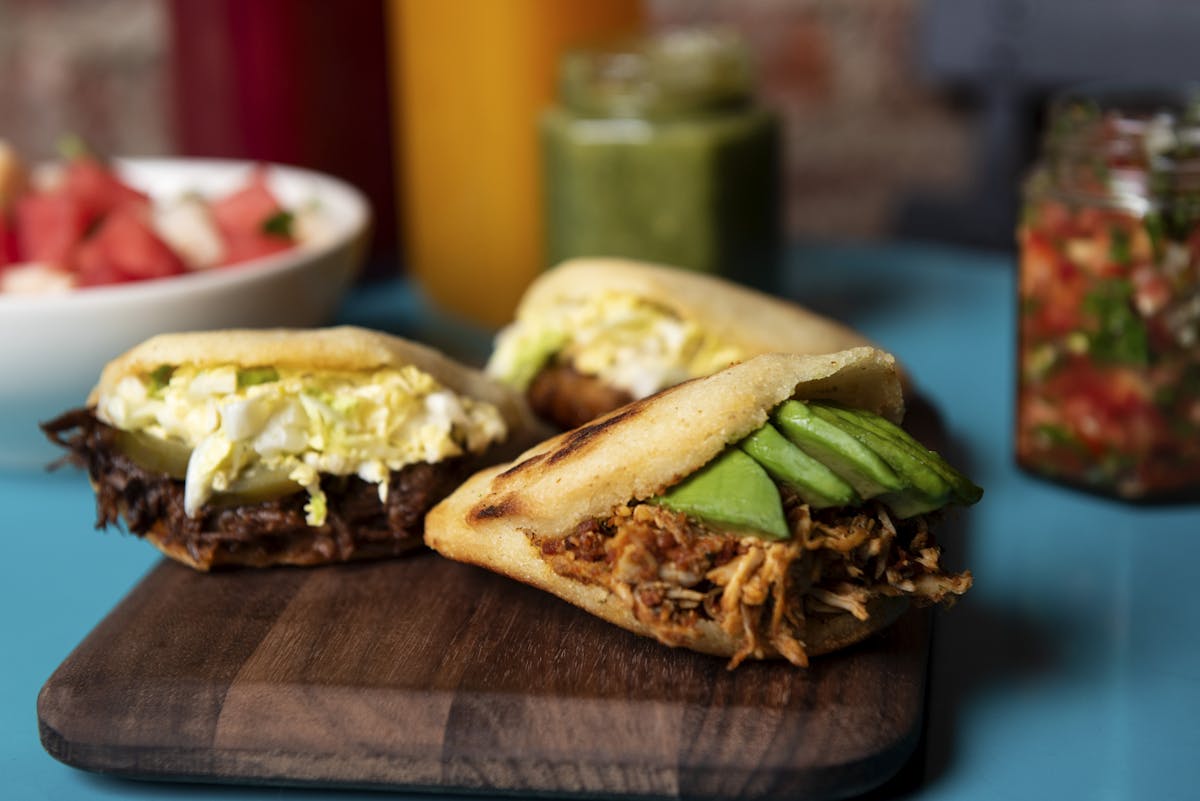 a sandwich sitting on top of a wooden table