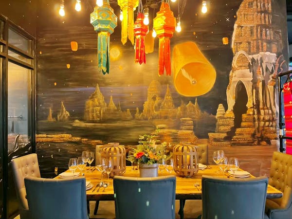 a group of people sitting at a table in a restaurant
