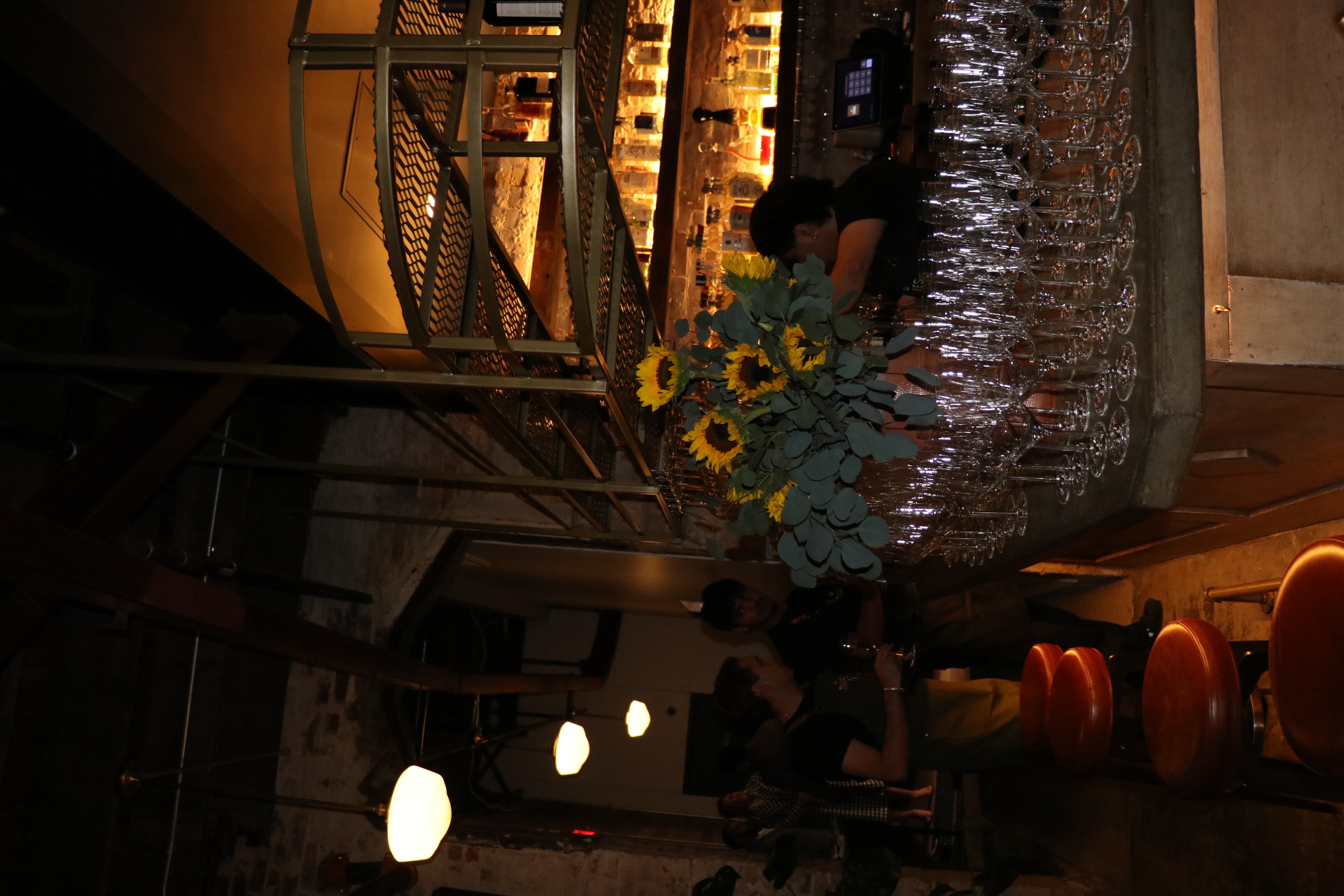 a group of people sitting at a bar