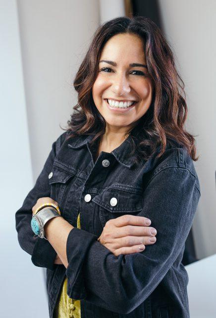 a woman holding a cell phone