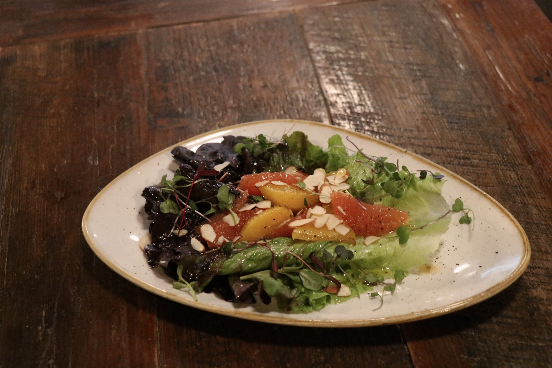 a plate of food sitting on top of a wooden table