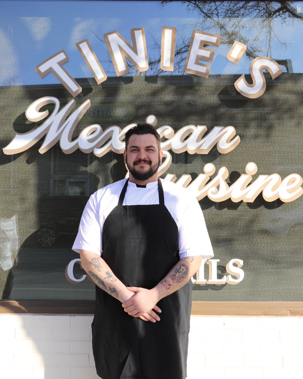 a man standing in front of a building