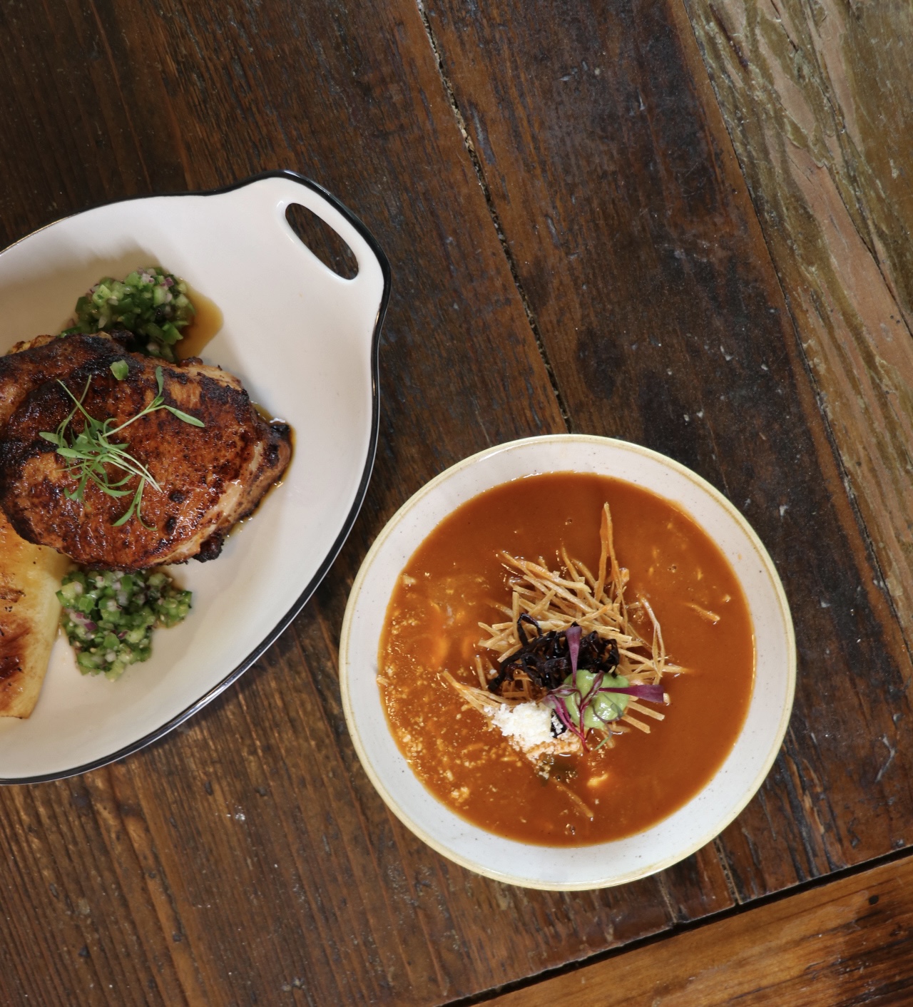 a plate of food sitting on top of a wooden table