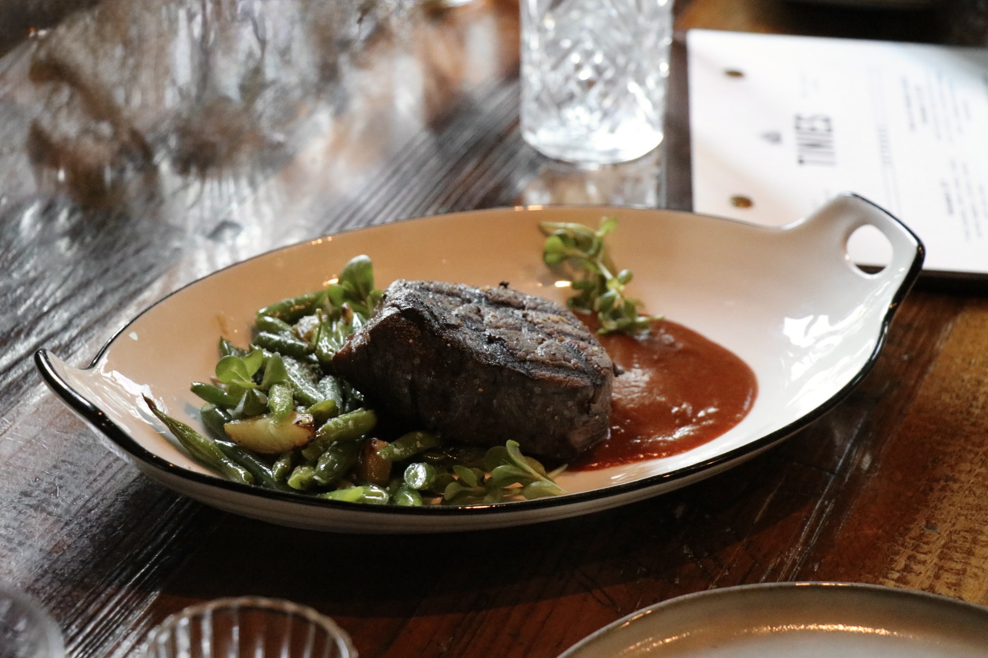 a bowl of food on a plate on a table