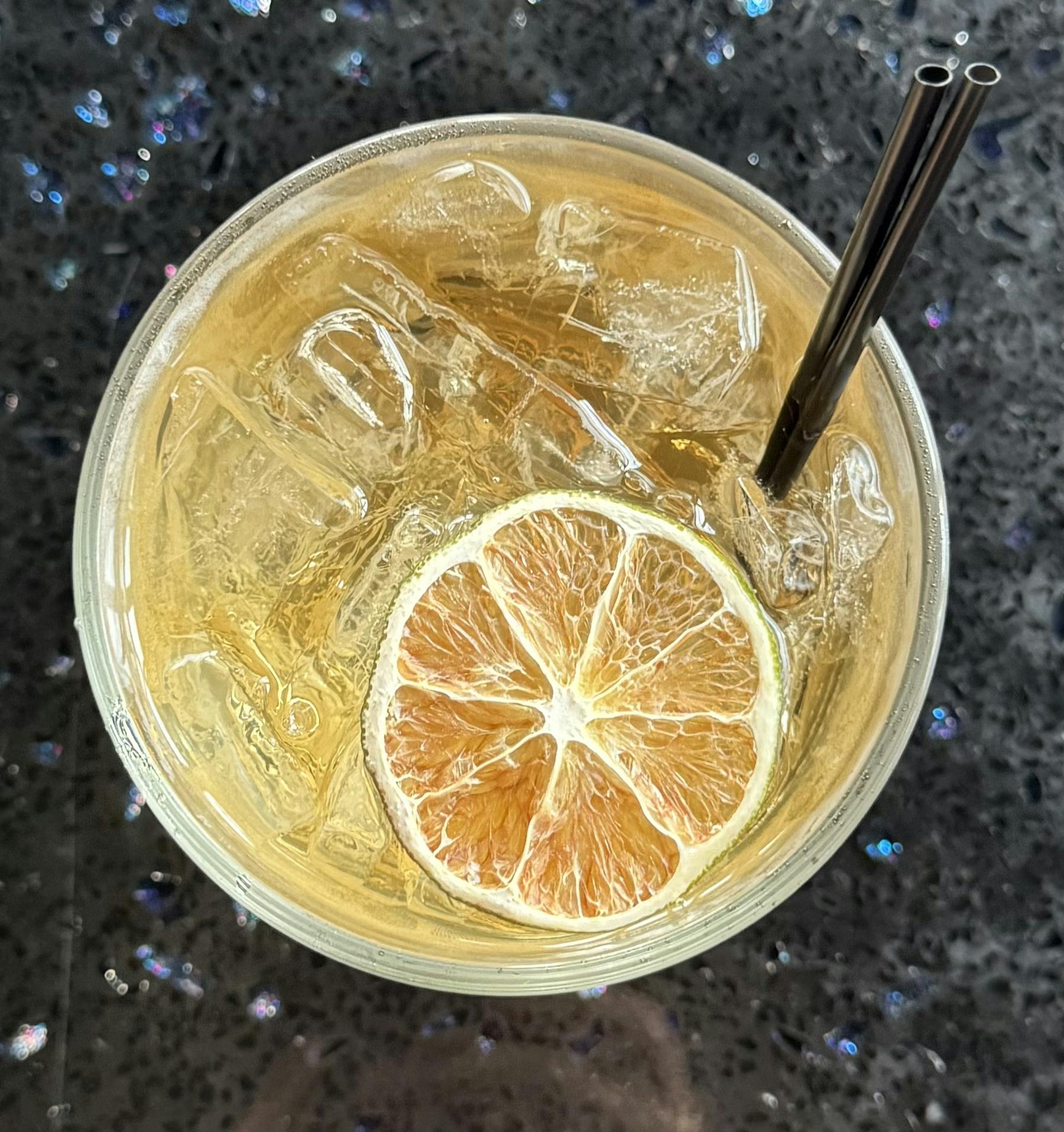 a bowl of oranges on a table