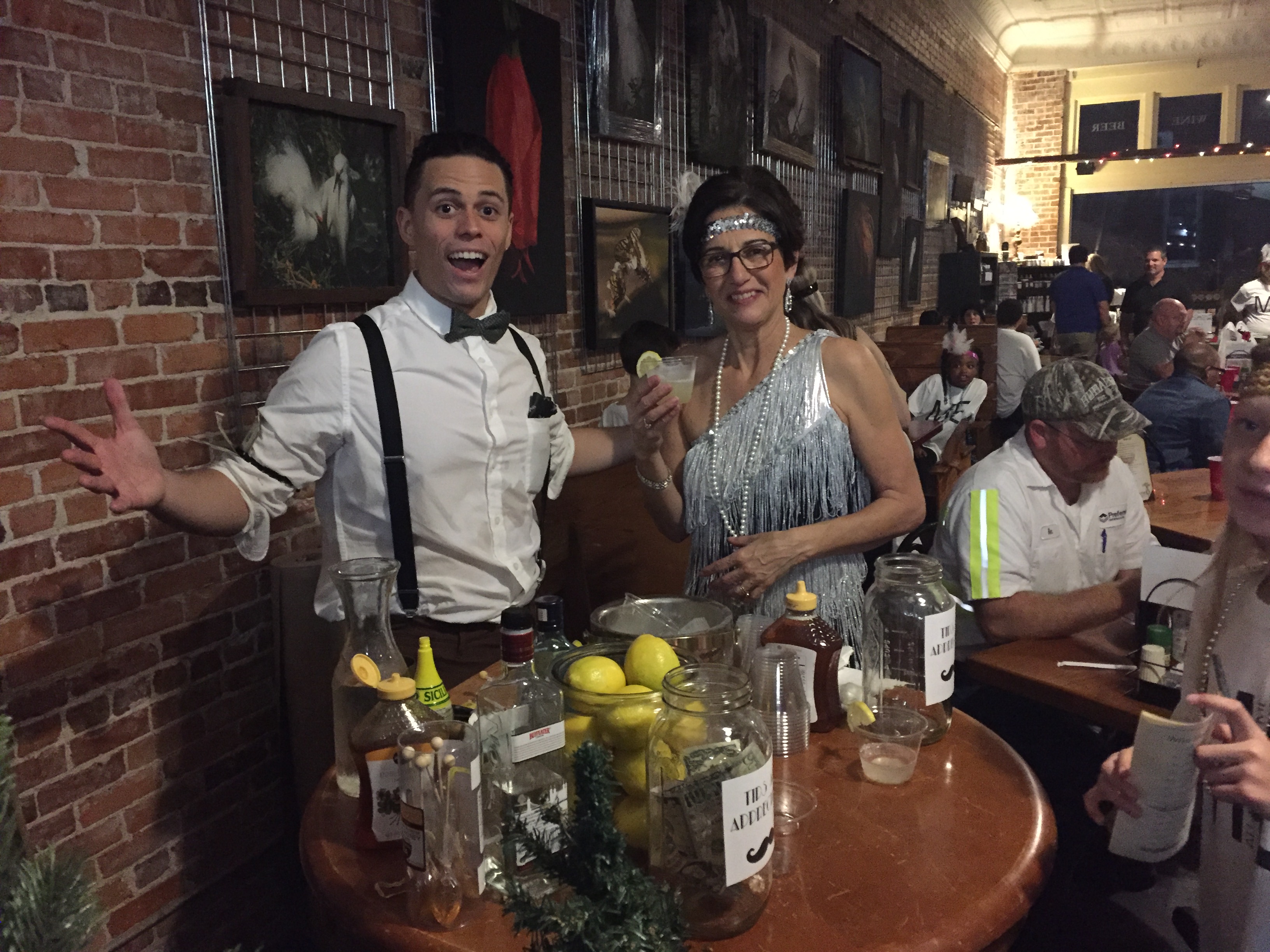 a group of people sitting at a table in a restaurant