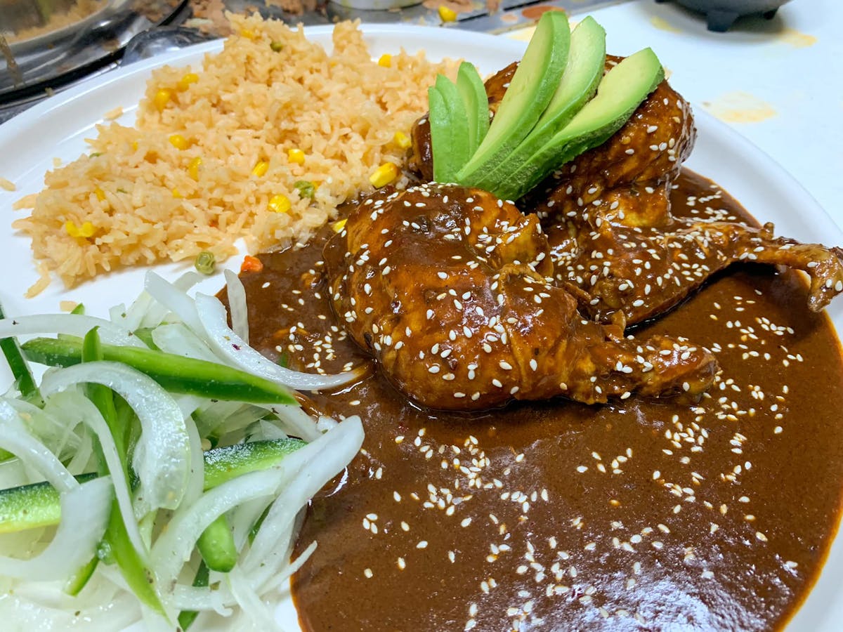 a plate of food with rice and vegetables