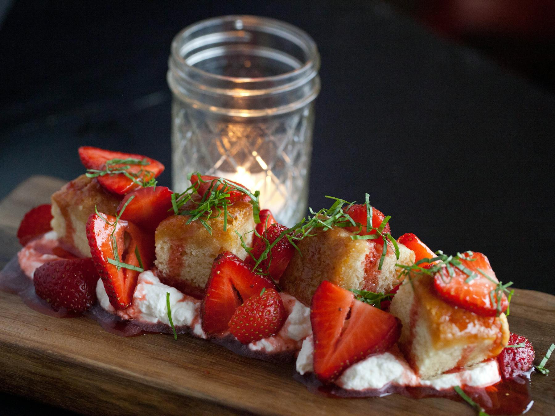 a plate of food with a slice of cake on a table