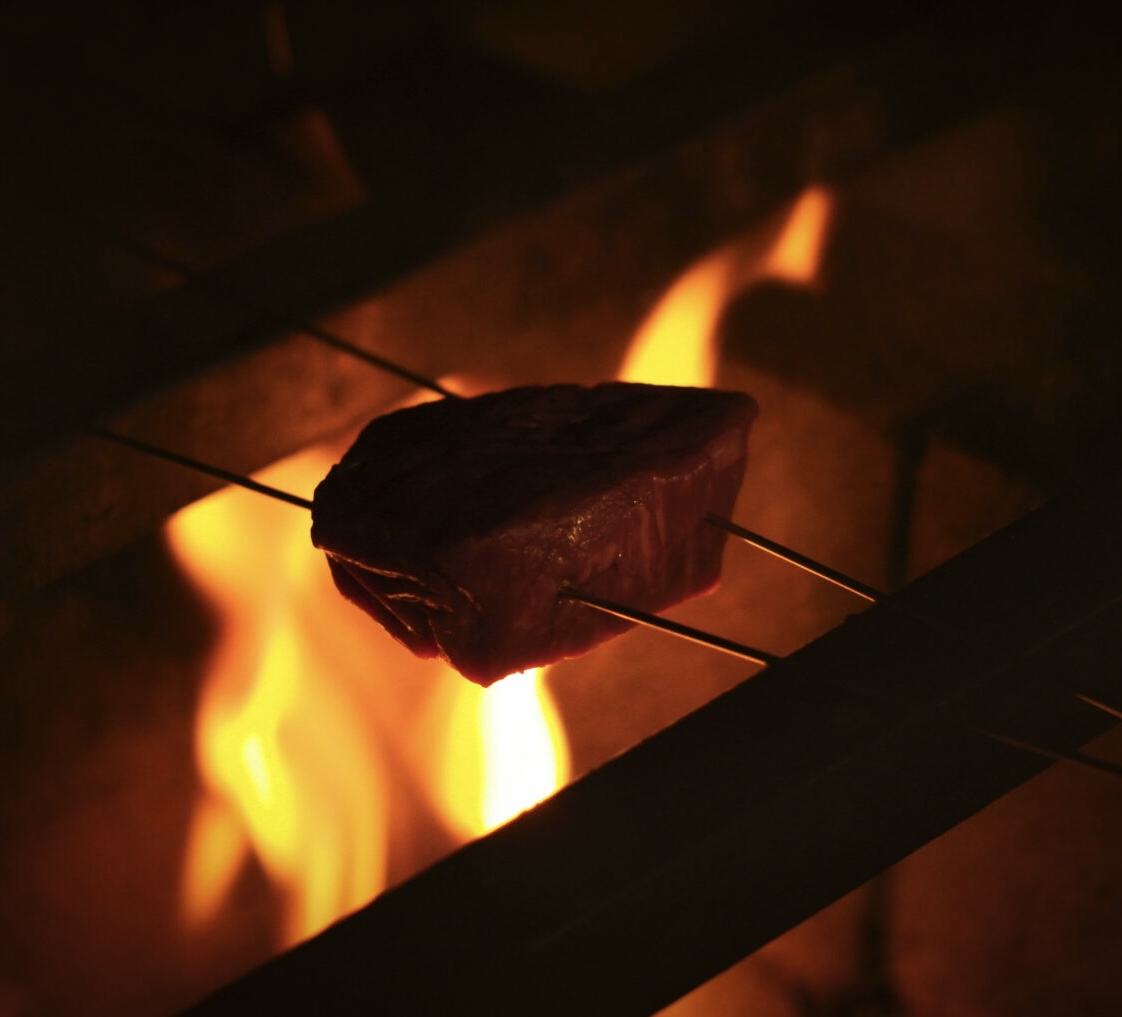 a stove top oven sitting next to a fireplace
