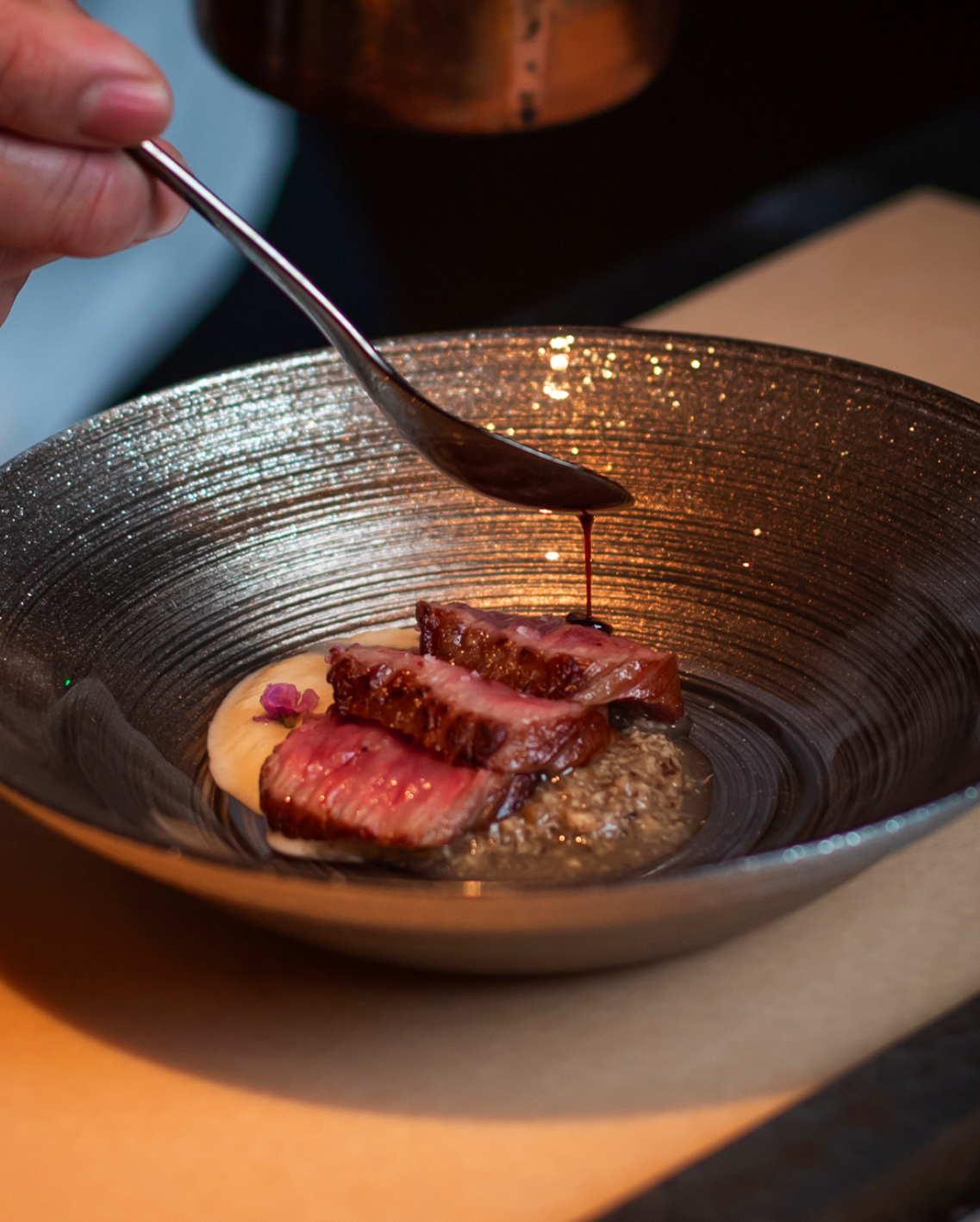 a bowl of food with a knife
