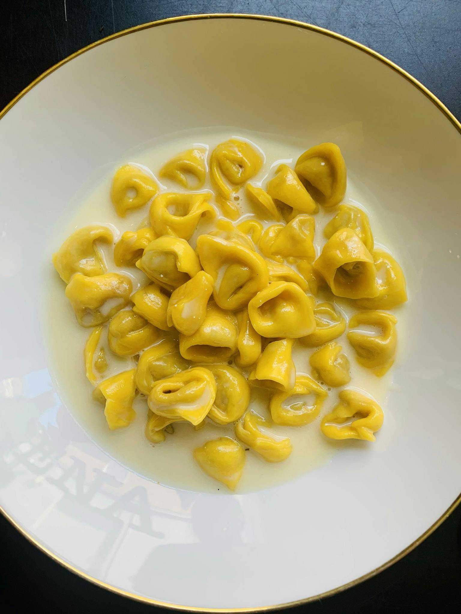 a plate topped with pasta and cheese