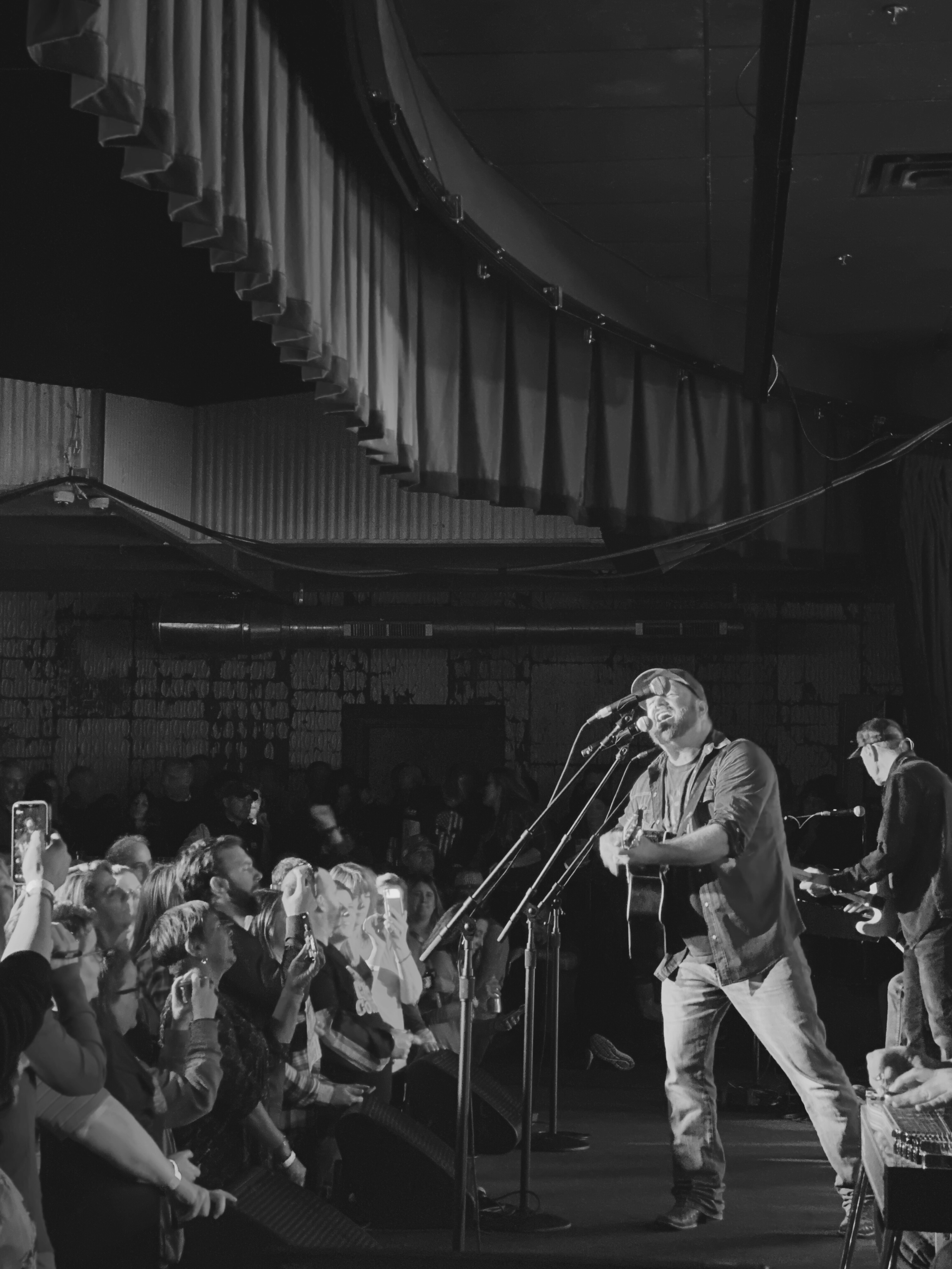 a group of people standing in front of a crowd