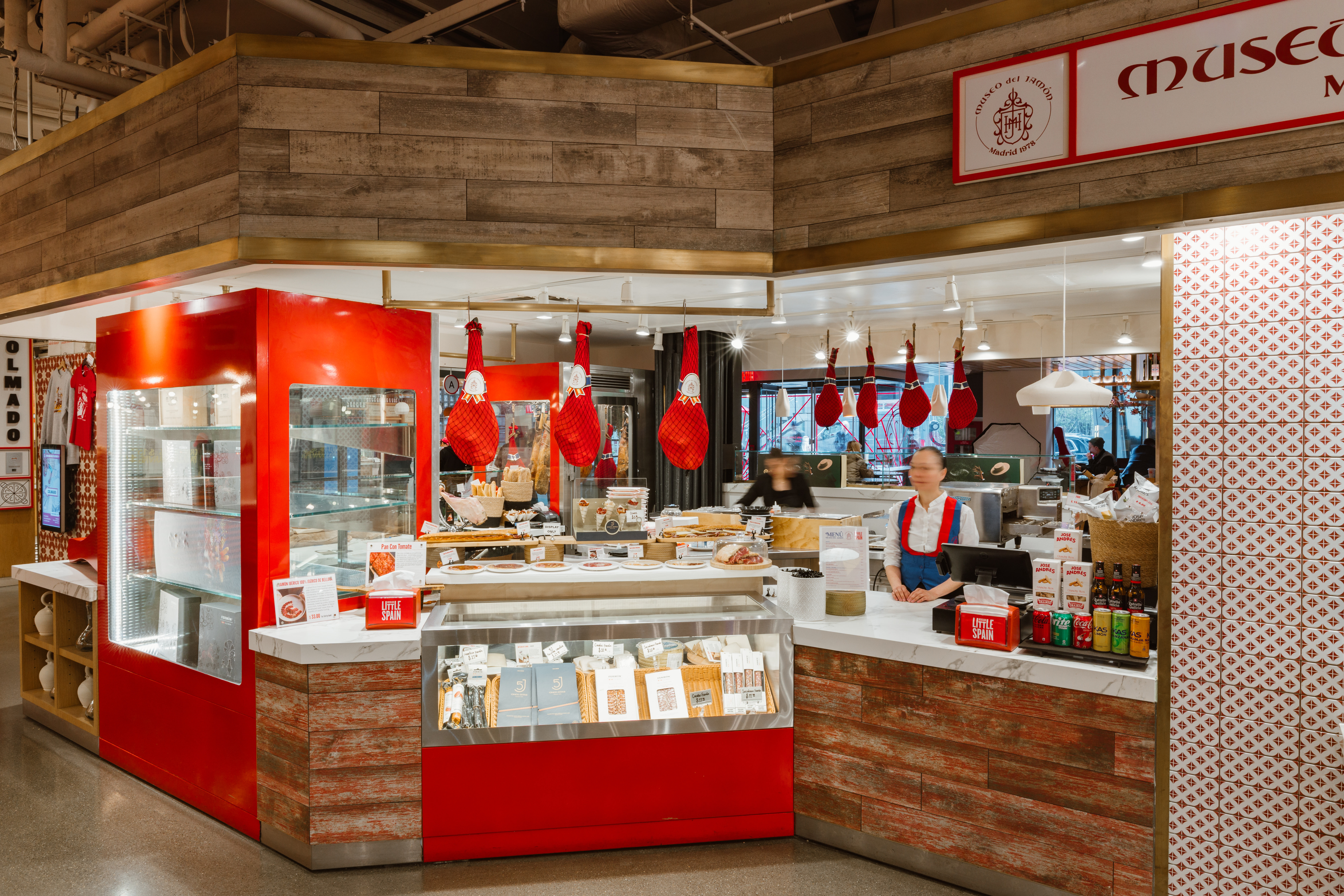 a store with a counter and a woman behind it