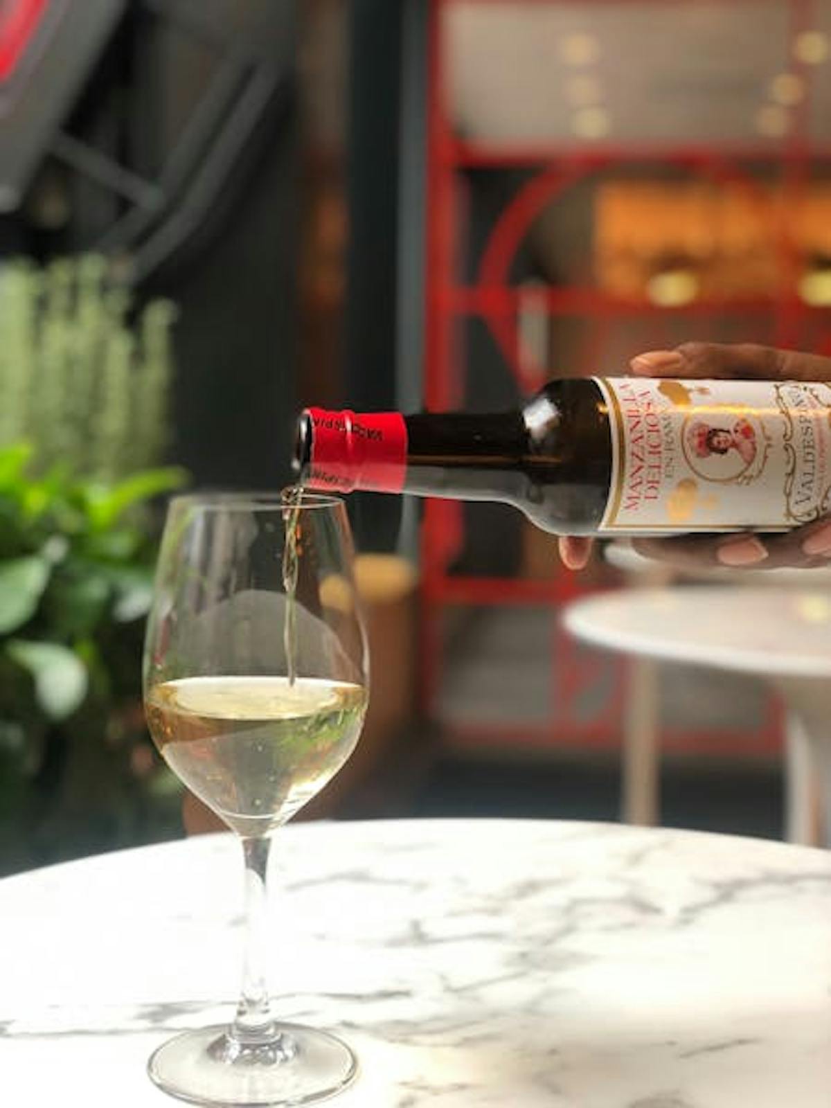 a glass of wine on a table