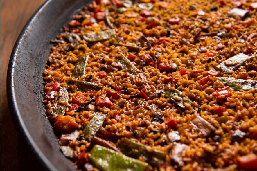 a close up of a paella