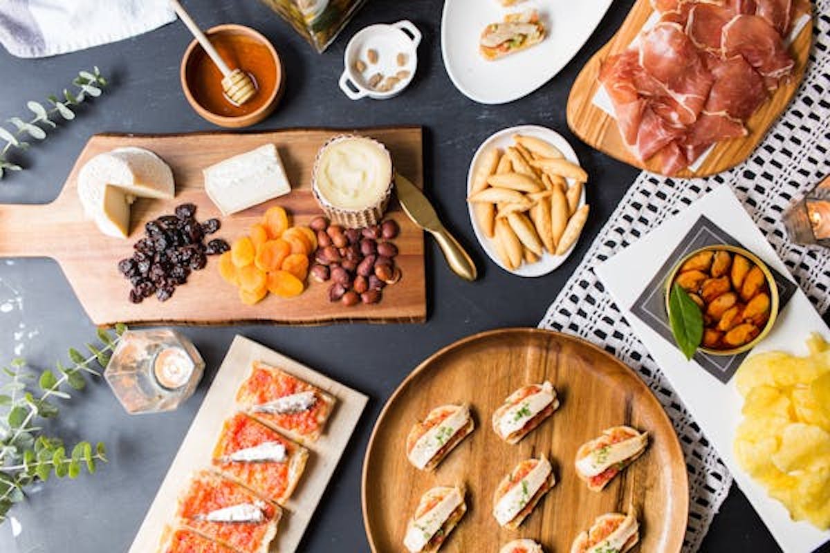 a bunch of different types of food on a table