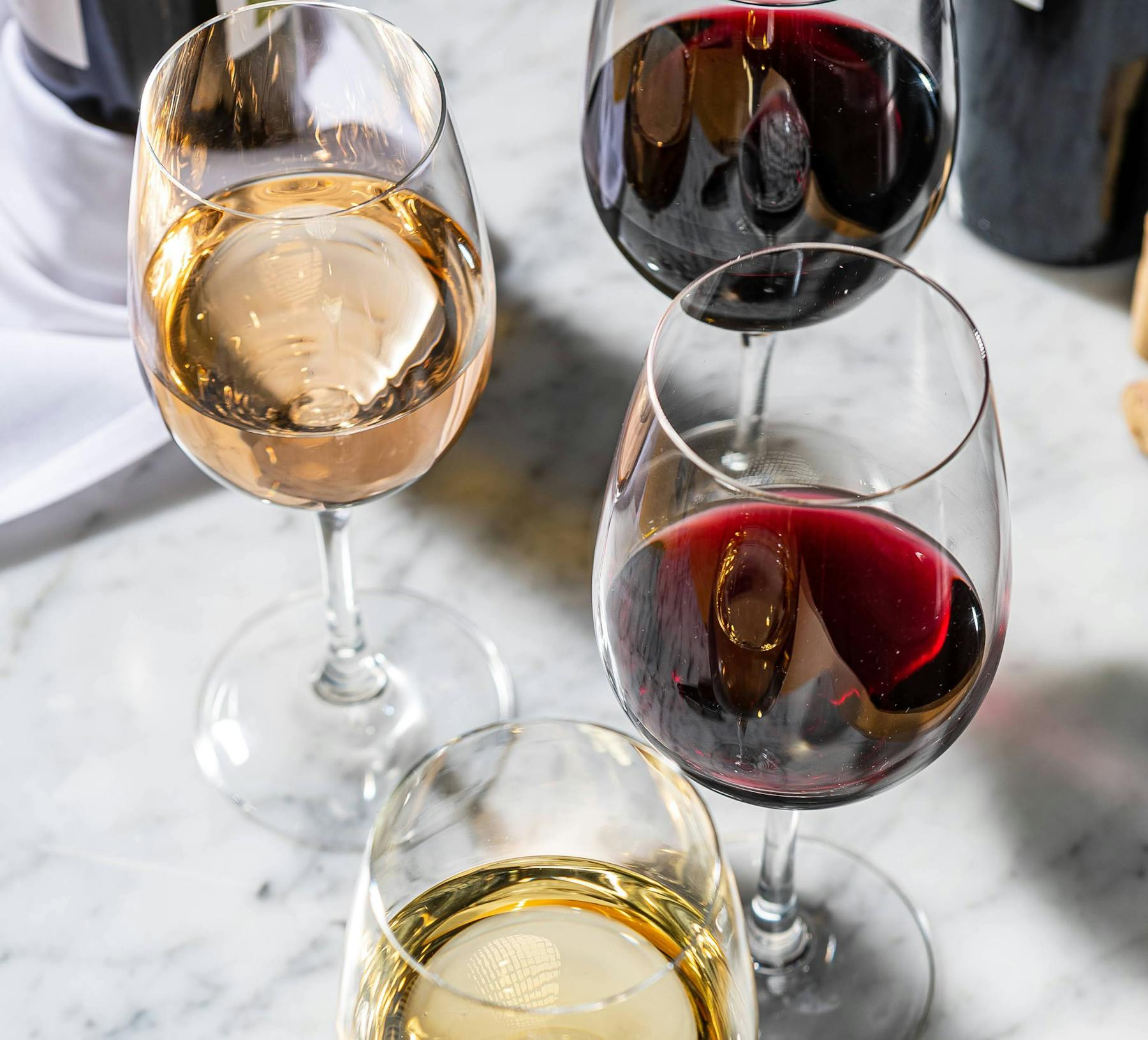 a glass filled with wine glasses