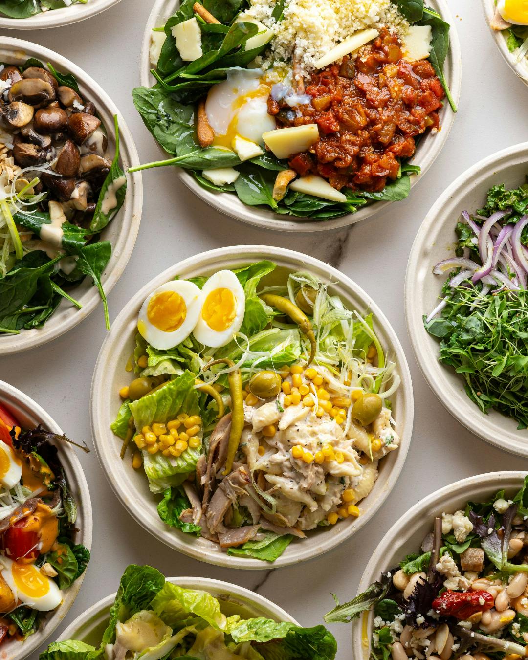 a bowl filled with different types of food on a table
