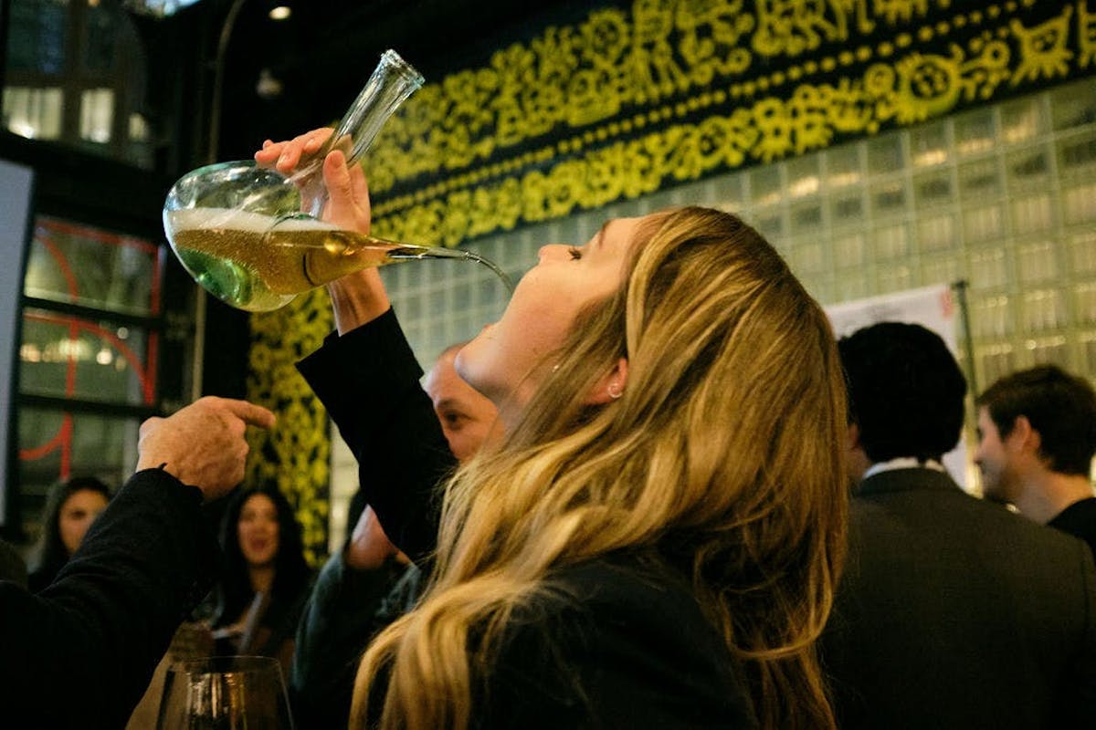 a person drinking wine