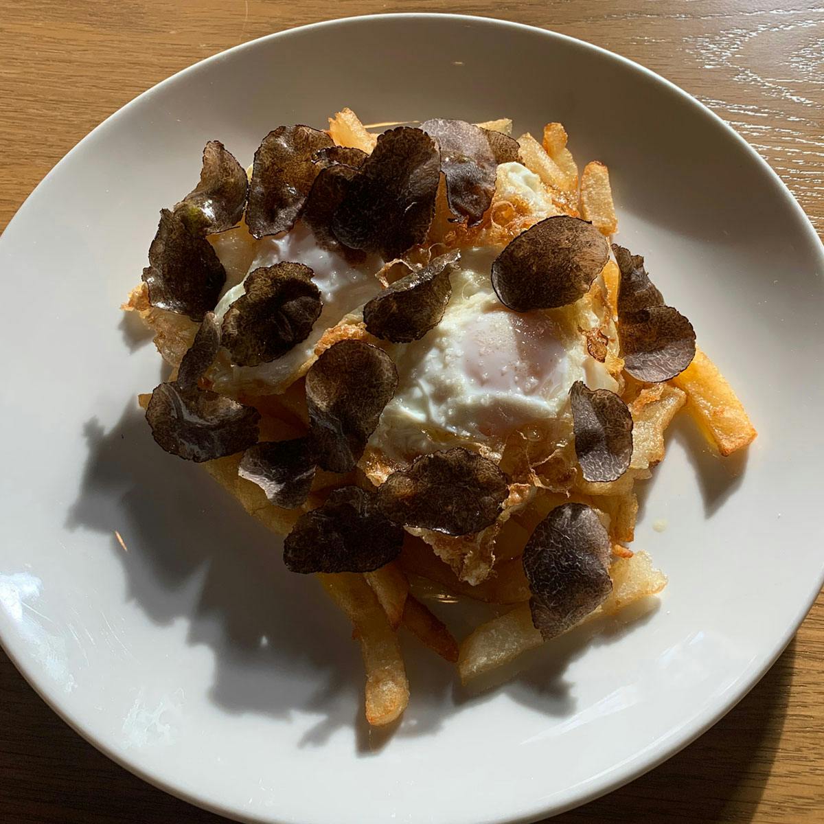 a white plate topped with a piece of food