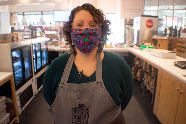 a woman standing in a kitchen