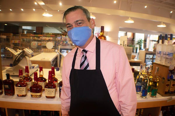 a man standing in front of a store