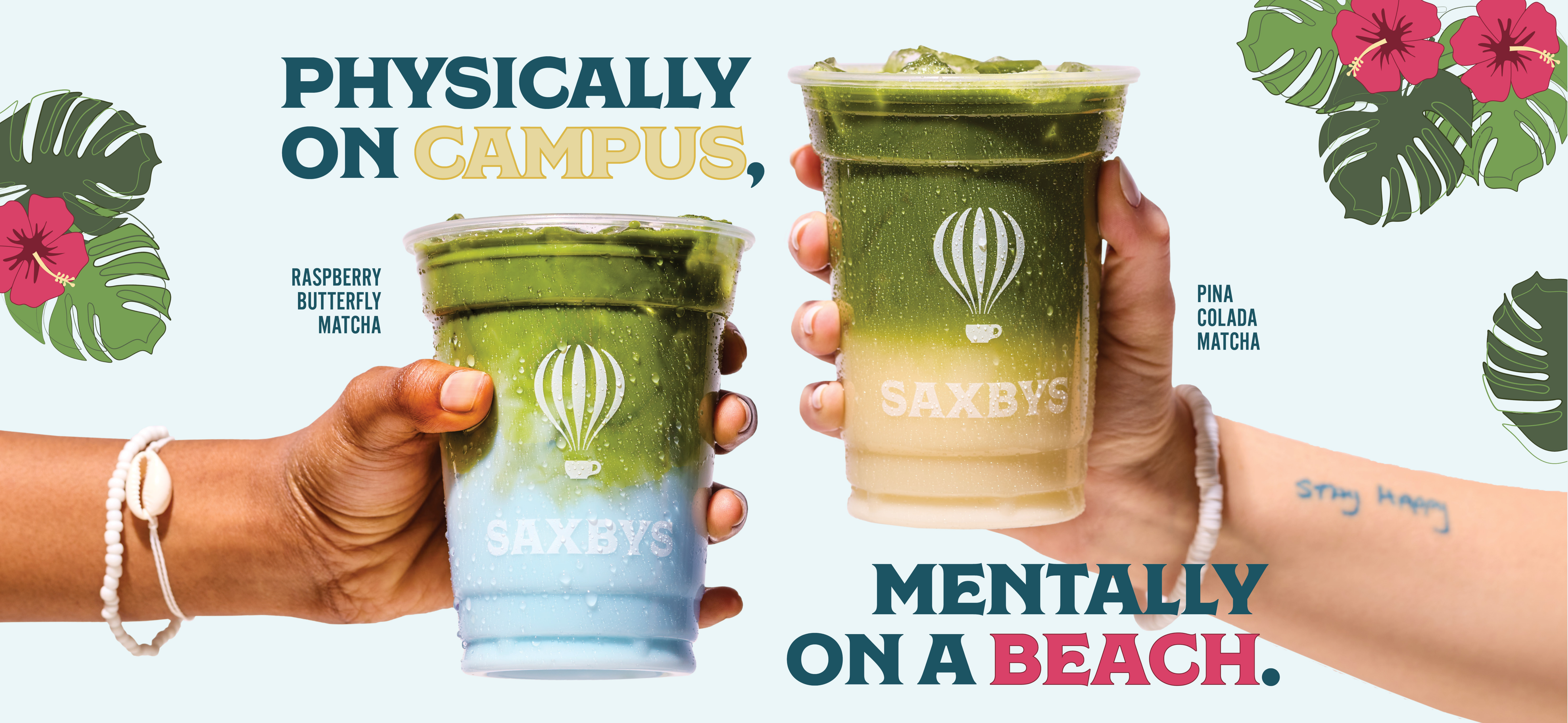 two hands holding two matchas