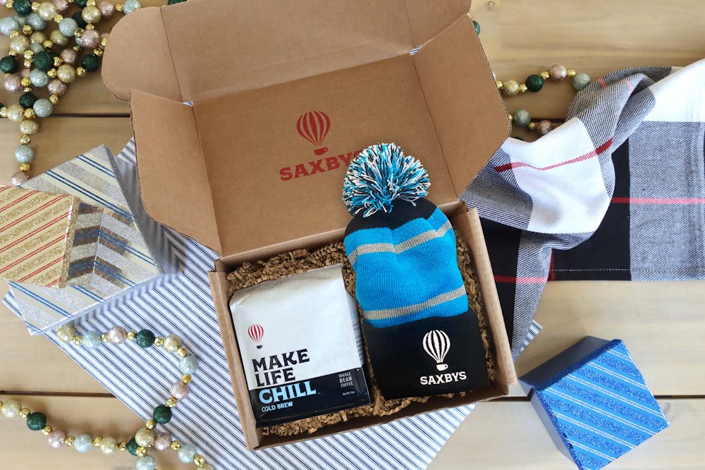 a box with a coffee bag and a beanie
