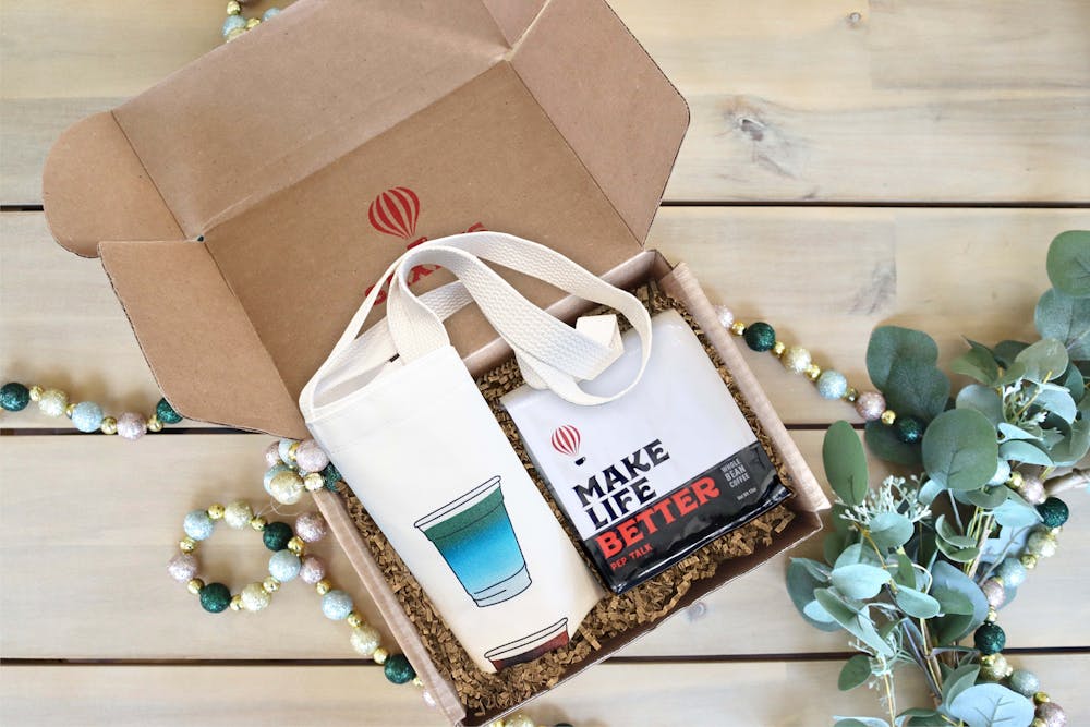 a tote bag and coffee bag in a box