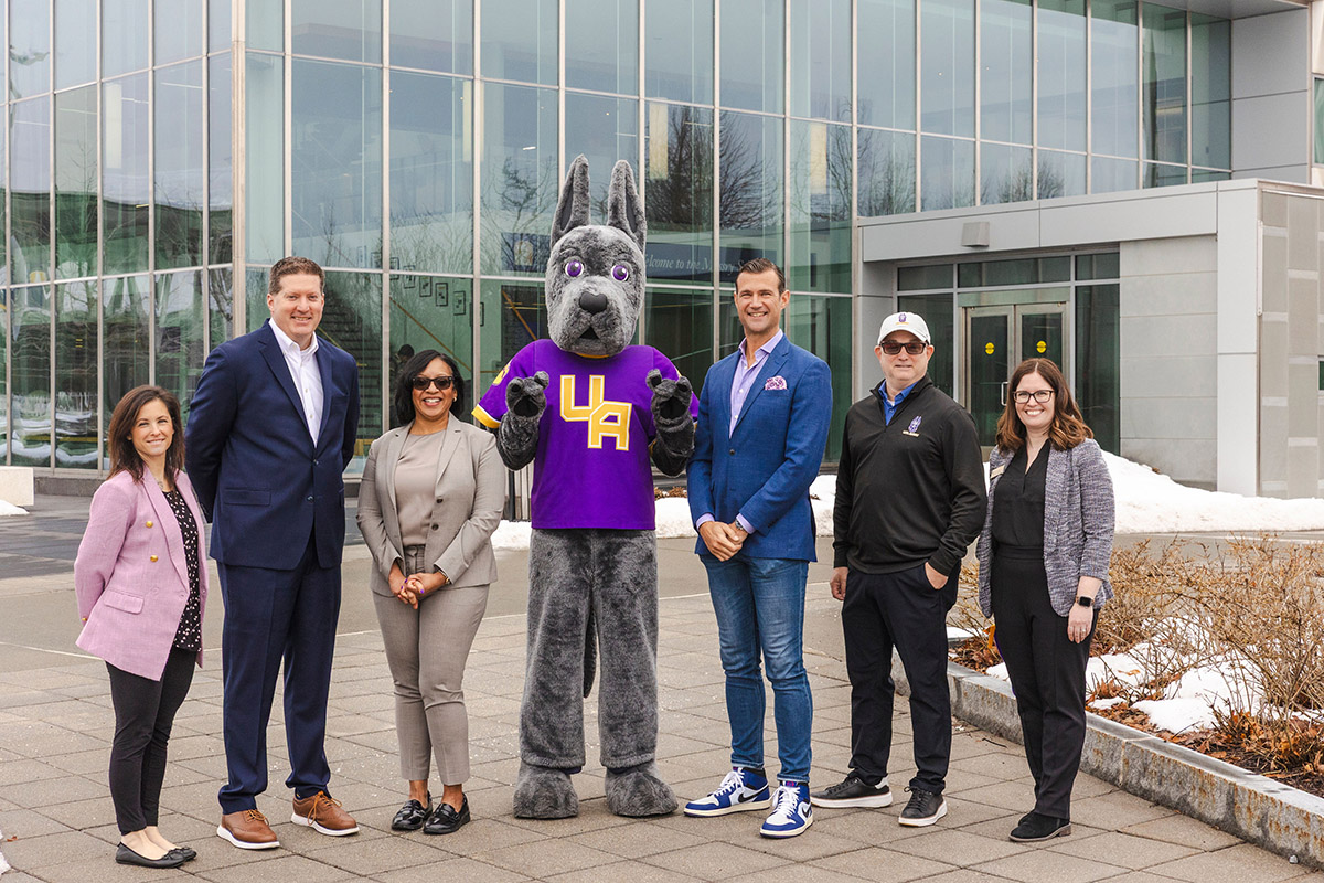 a group of people standing in front of a building