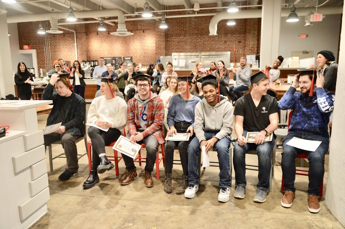 a group of people standing in a room
