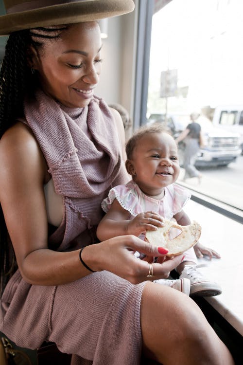 a woman holding her baby