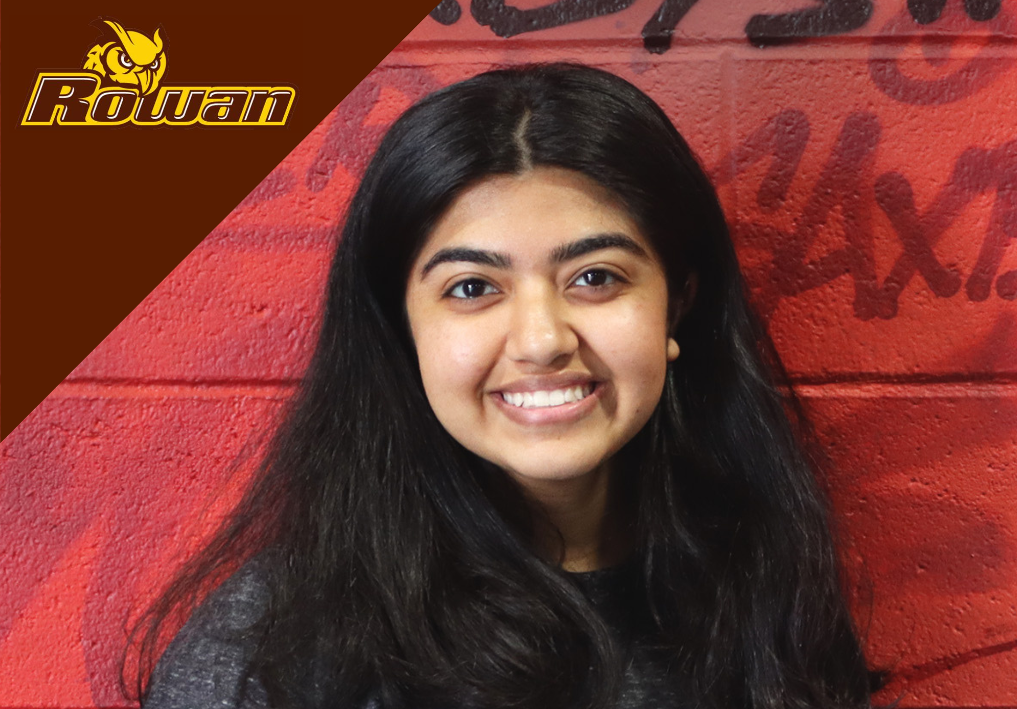 a woman smiling and posing for the camera