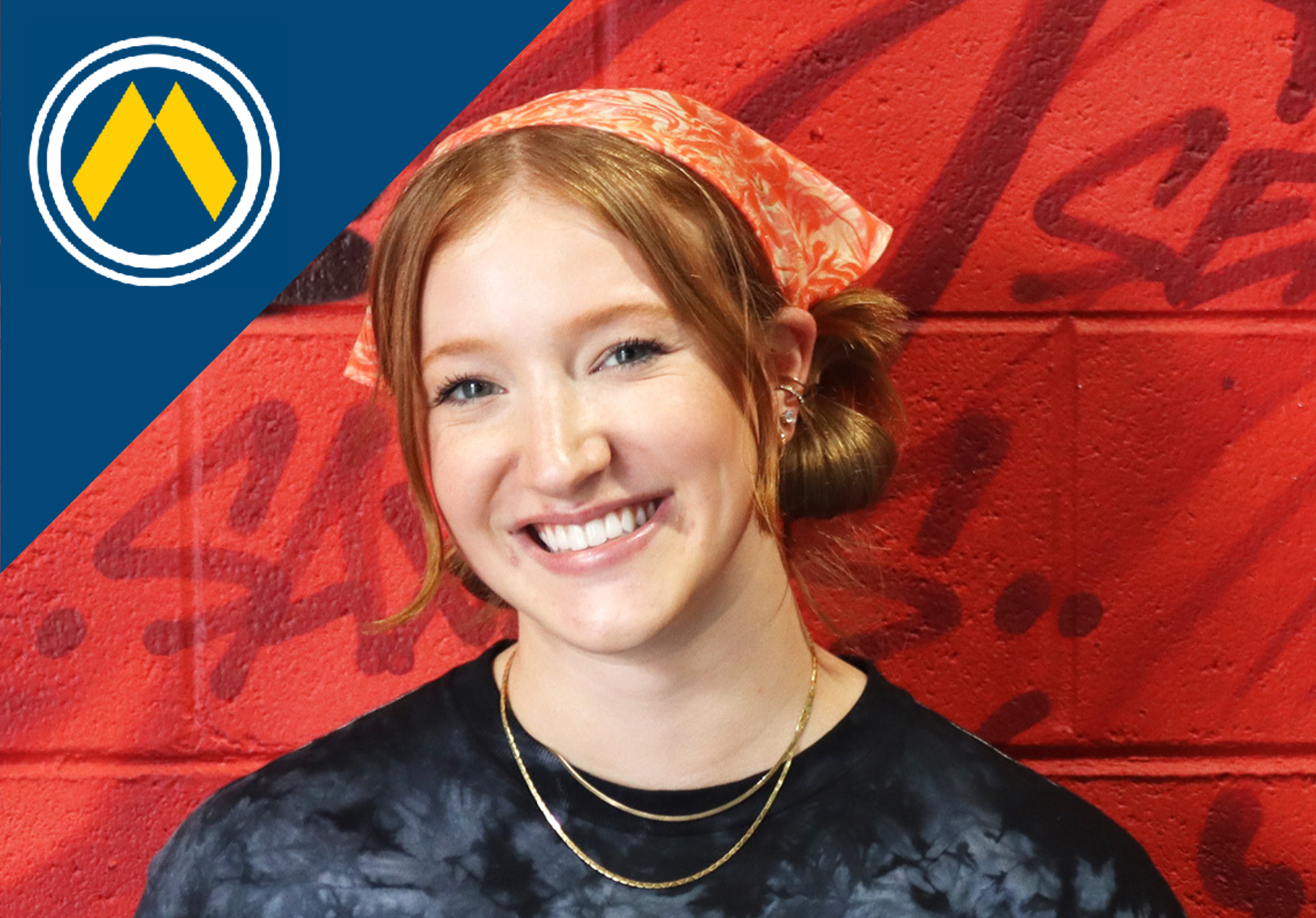 a person standing in front of a brick wall