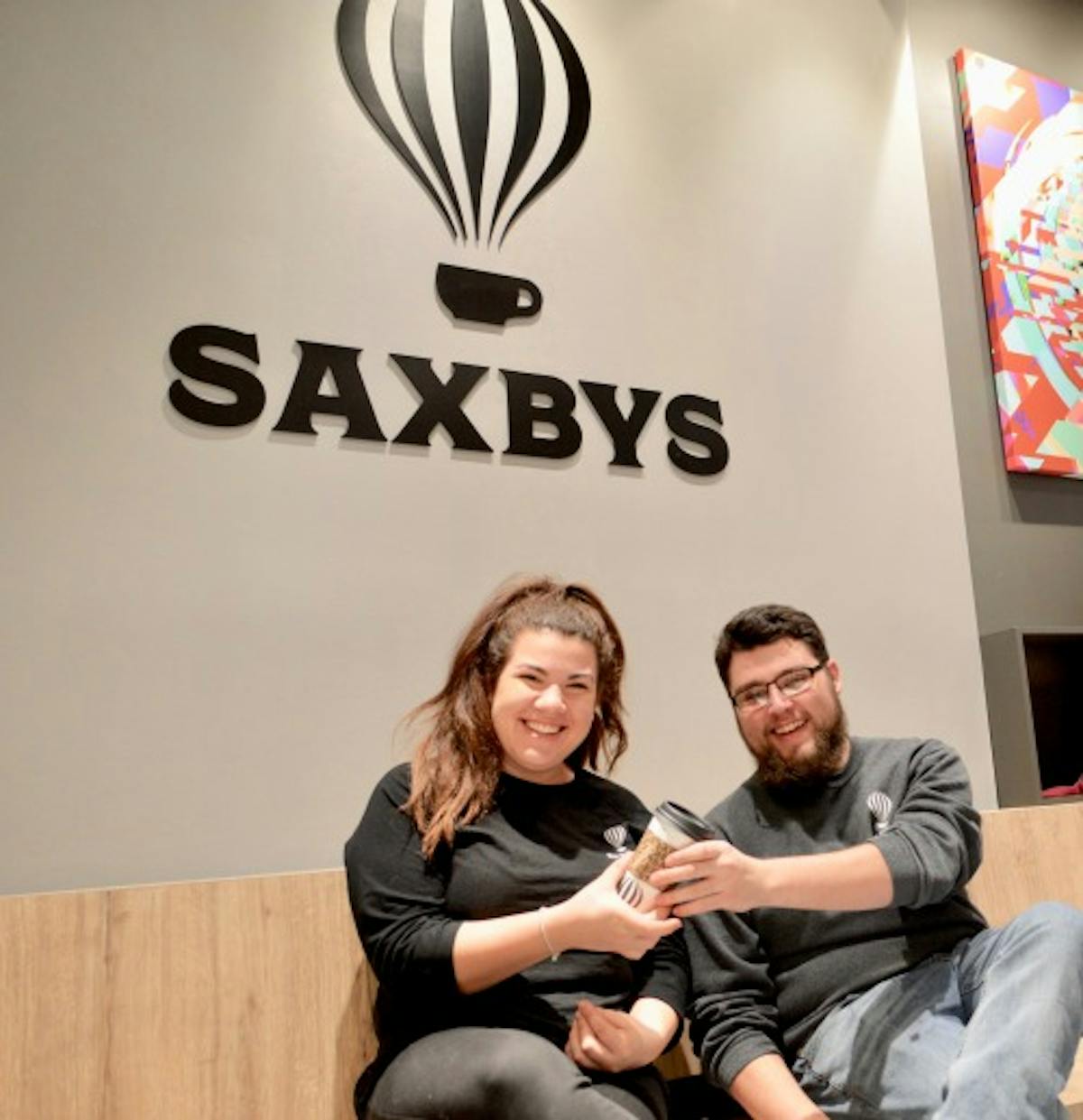 a group of people sitting posing for the camera