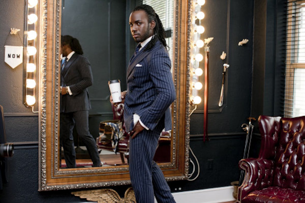 a person standing in front of a mirror posing for the camera